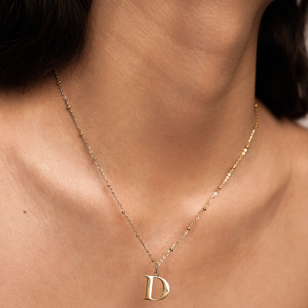 D Initial Necklace In Gold
