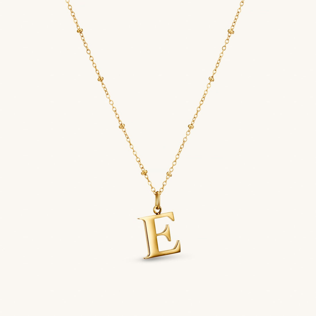 E Initial Necklace In Gold
