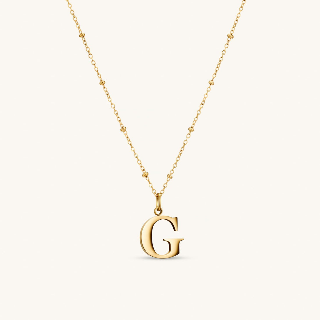 G Initial Necklace In Gold
