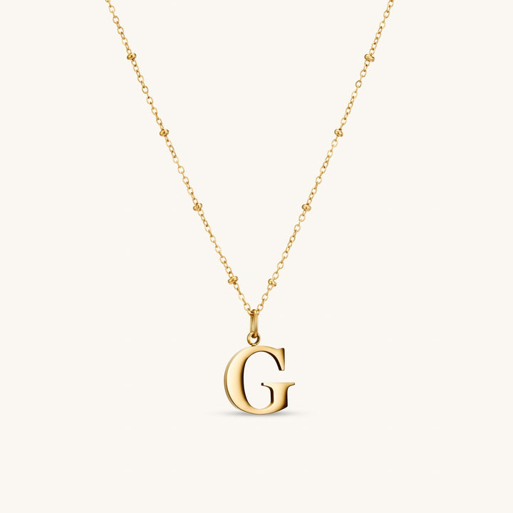 G Initial Necklace In Gold
