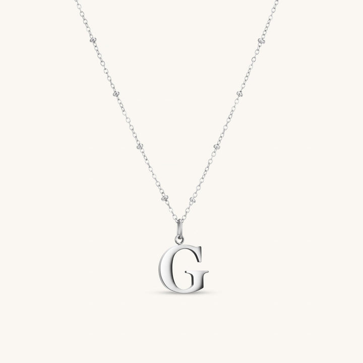 G Initial Necklace In Silver
