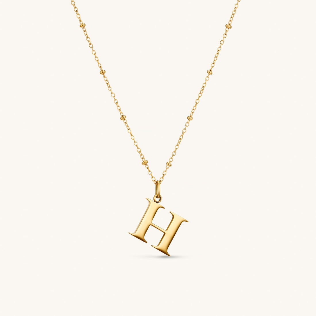 H Initial Necklace In Gold
