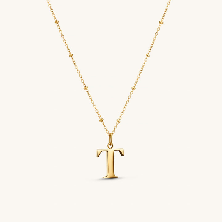 T Initial Necklace In Gold