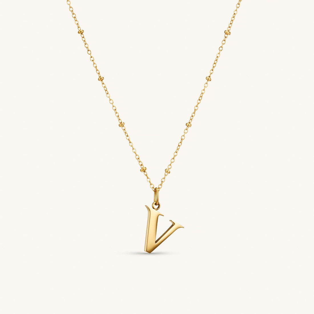 V Initial Necklace In Gold
