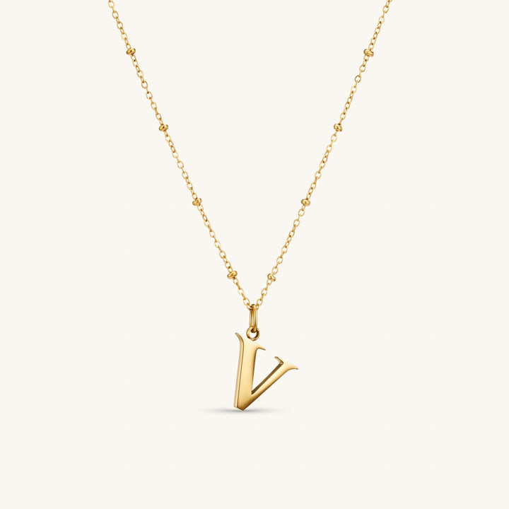 V Initial Necklace In Gold
