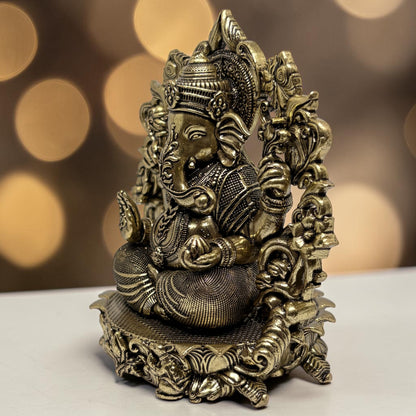 Brass Ganapati with Floral Arch